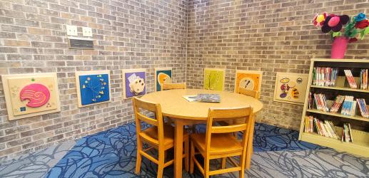 Reading table and play panels at library for children