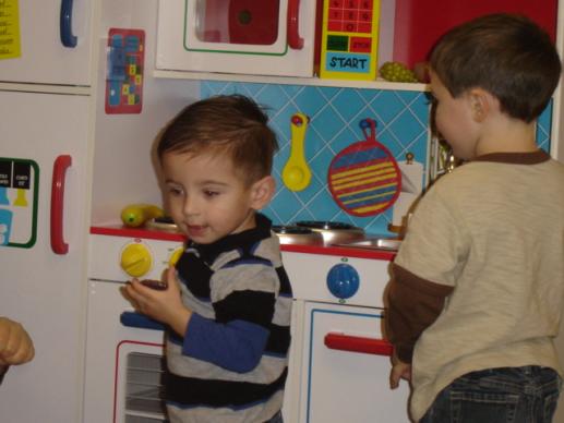 Boys always love the kitchen in the Family Place Workshop