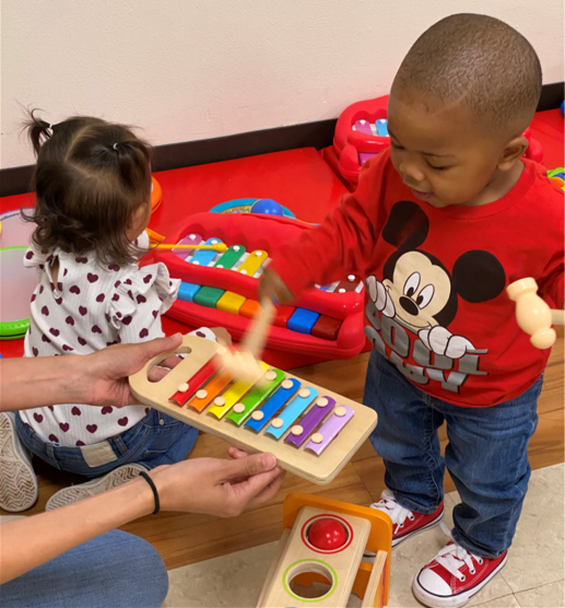 Boy and girl play with xylophones