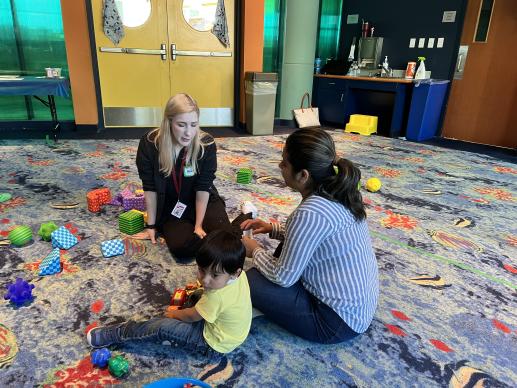 Parent talking to a professional at Allen Public Library's Parent Child Playtime