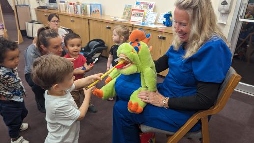 Dental hygienist teaching about dental health to our toddlers