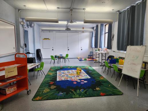 This is the general set-up of our Play & Connect program in our Community Room, including playtime stations and an information/resources station.