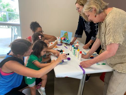 Karen Hill and Barbara Walz, RN, engage with participants