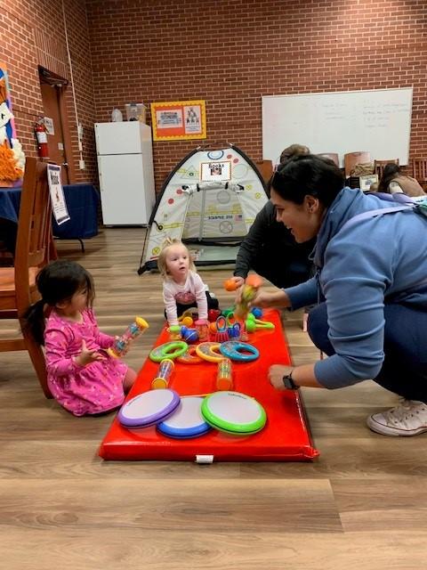 Children and moms playing musical instruments