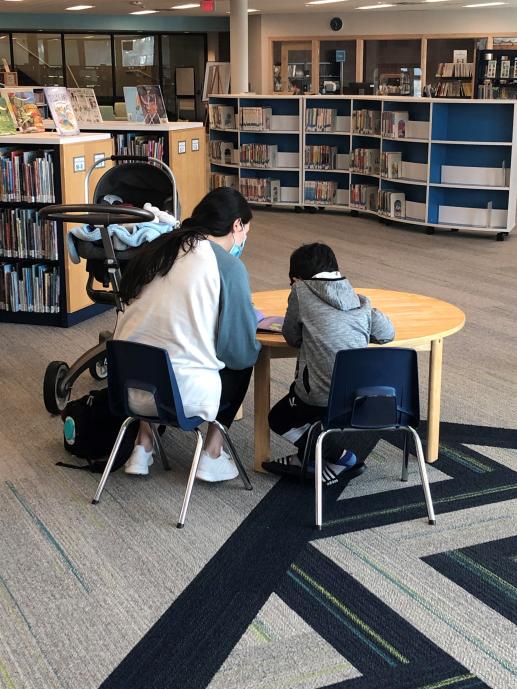 caregiver and child reading