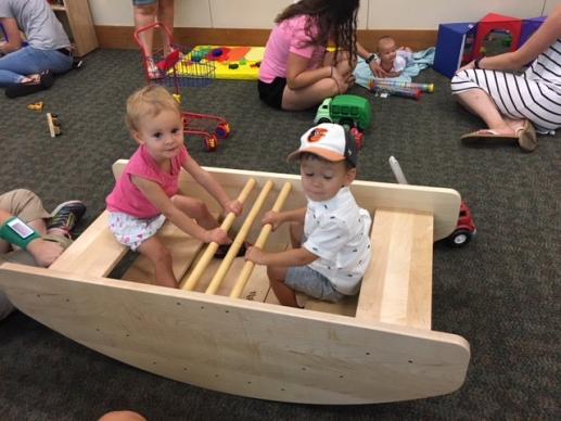 Liberty and Alden in the row boat during the Stepping Stones Parent Caregiver Workshop at the Harker Heights Public Library